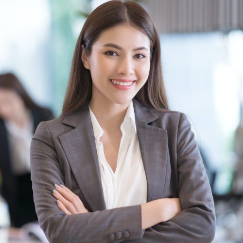 portrait-of-successful-young-asian-businesswoman-at-office-e1658720252859.jpg